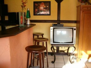 Bild der Ferienwohnung Pondruff mit Theke, Sitzm&ouml;glichkeiten und Fernseher