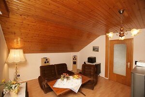 Bild der Privatpension Grabow mit Wohnstube und Fernseher 2